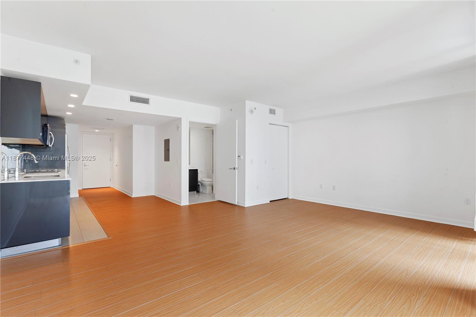 31 Southeast 6th Street, Unit 705 Miami, FL 33131 - Photo 10 of 12 a view of kitchen with stainless steel appliances with kitchen island