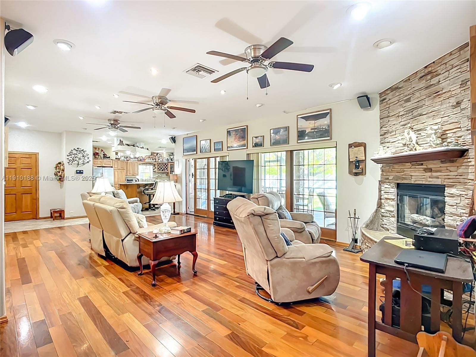 3144 Shell Lane LaBelle, FL 33935 - Photo 14 of 69 a living room with furniture and a fireplace