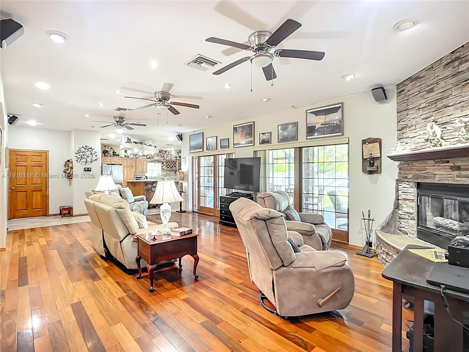 3144 Shell Lane LaBelle, FL 33935 - Photo 16 of 69 a living room with furniture and a fireplace