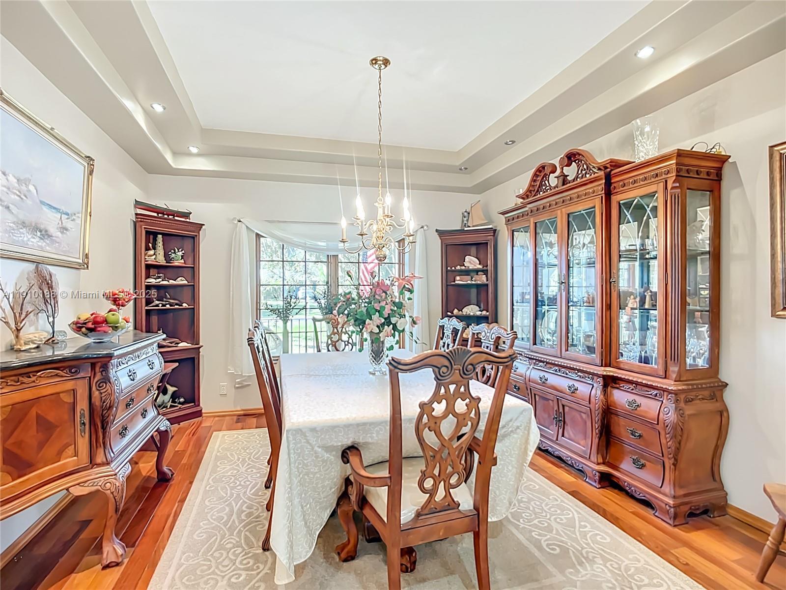 3144 Shell Lane LaBelle, FL 33935 - Photo 19 of 69 a dining room with furniture a chandelier and window