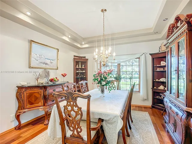 a kitchen with stainless steel appliances kitchen island granite countertop a sink and cabinets