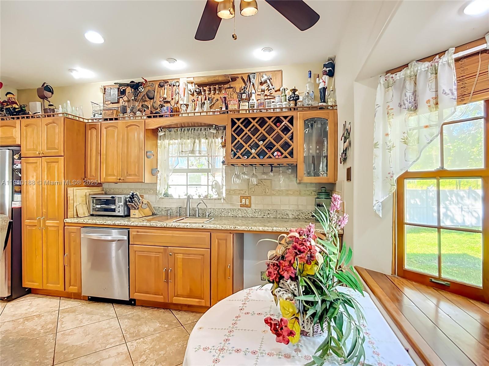 3144 Shell Lane LaBelle, FL 33935 - Photo 26 of 69 a kitchen with stainless steel appliances kitchen island granite countertop a sink and cabinets