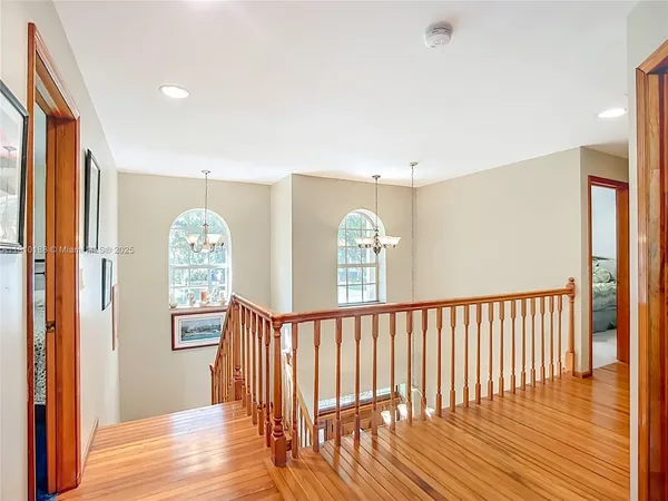 a bathroom with a tub a sink and glass door shower