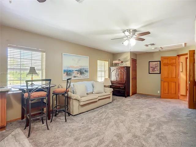 a bedroom with bed and window