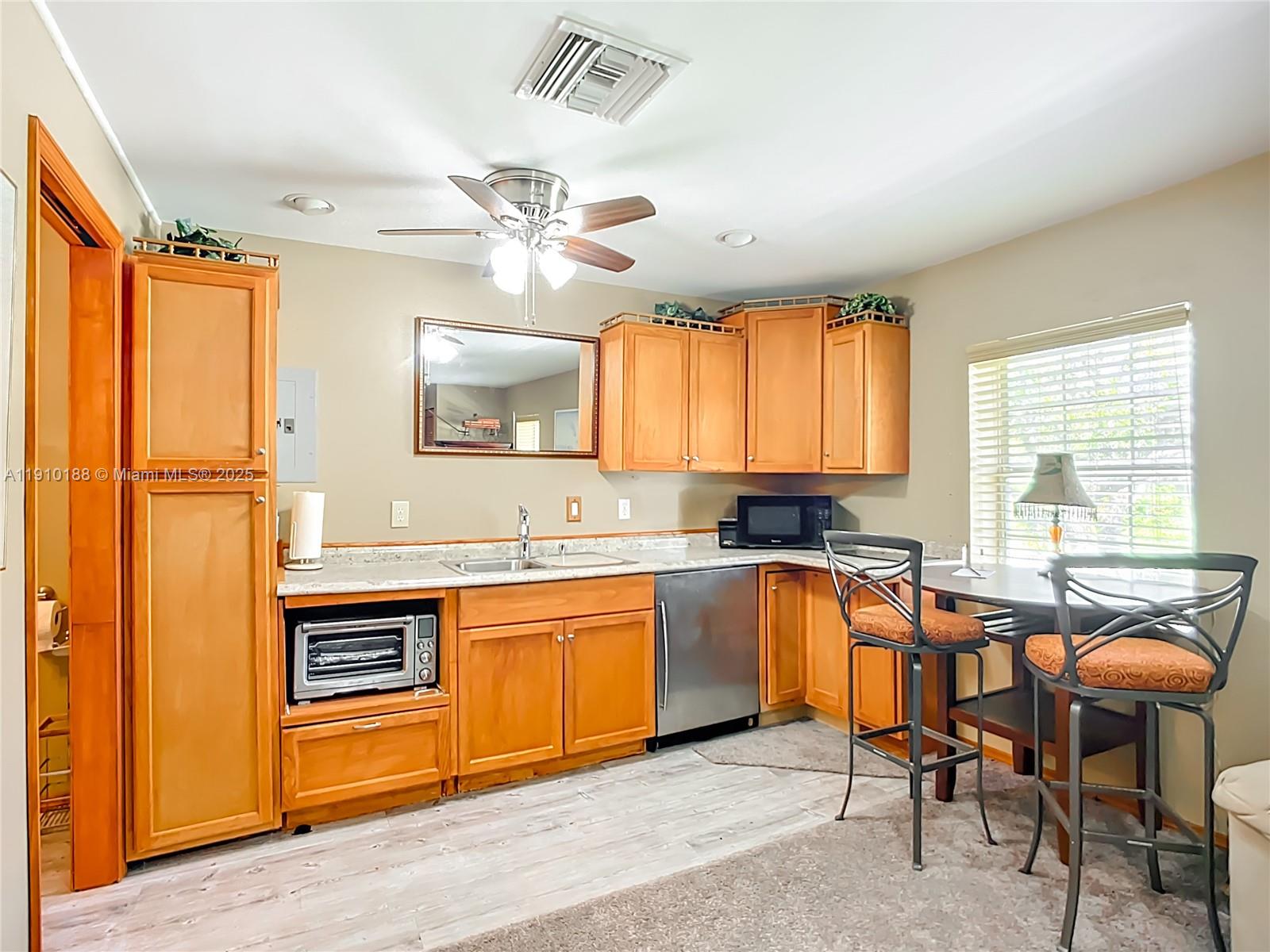 3144 Shell Lane LaBelle, FL 33935 - Photo 33 of 69 a view of a kitchen with a sink cabinets and wooden floor