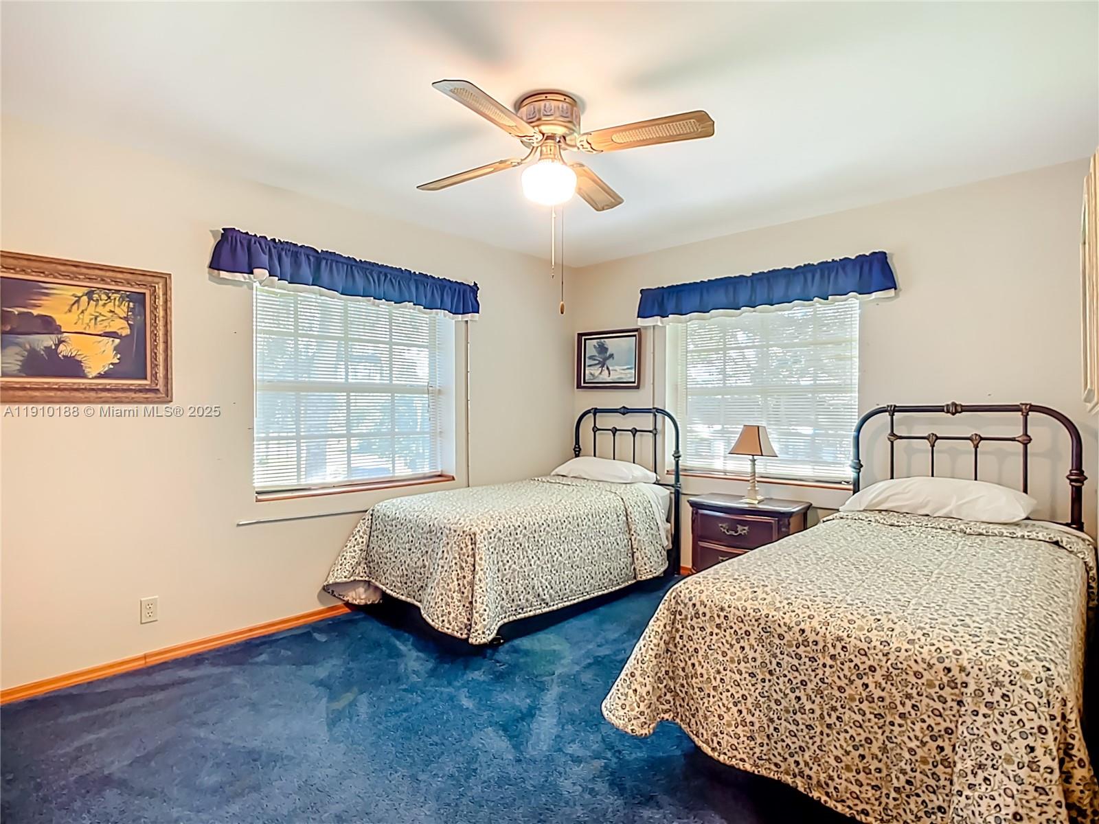 3144 Shell Lane LaBelle, FL 33935 - Photo 43 of 69 a bedroom with two beds and a window