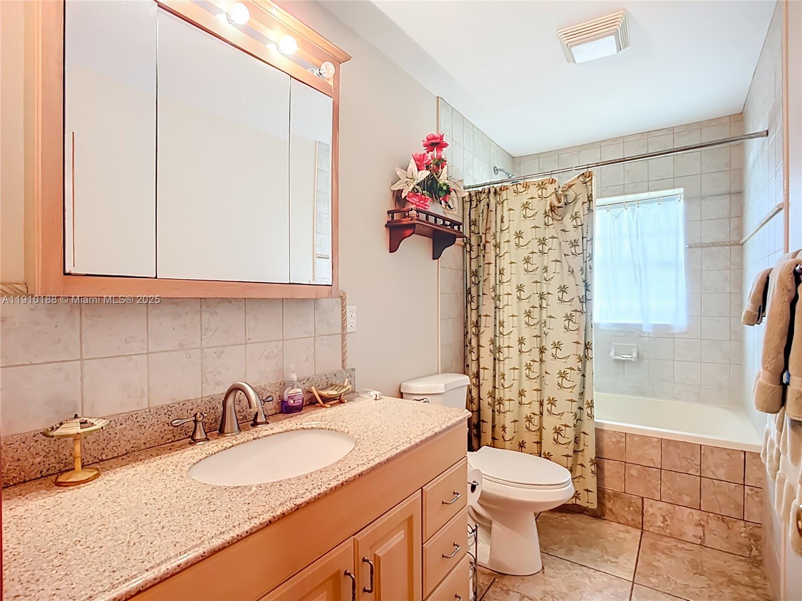 3144 Shell Lane LaBelle, FL 33935 - Photo 44 of 69 a bathroom with a granite countertop sink mirror vanity and toilet