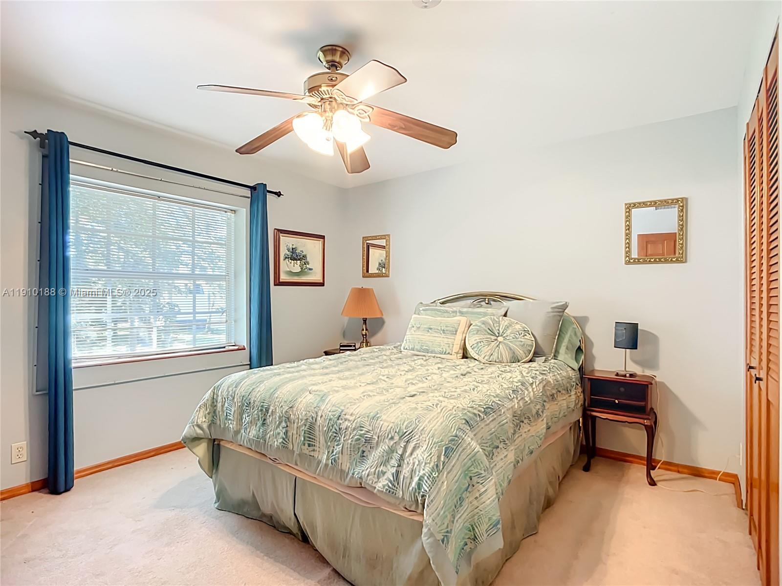 3144 Shell Lane LaBelle, FL 33935 - Photo 45 of 69 a bedroom with a bed and a chandelier