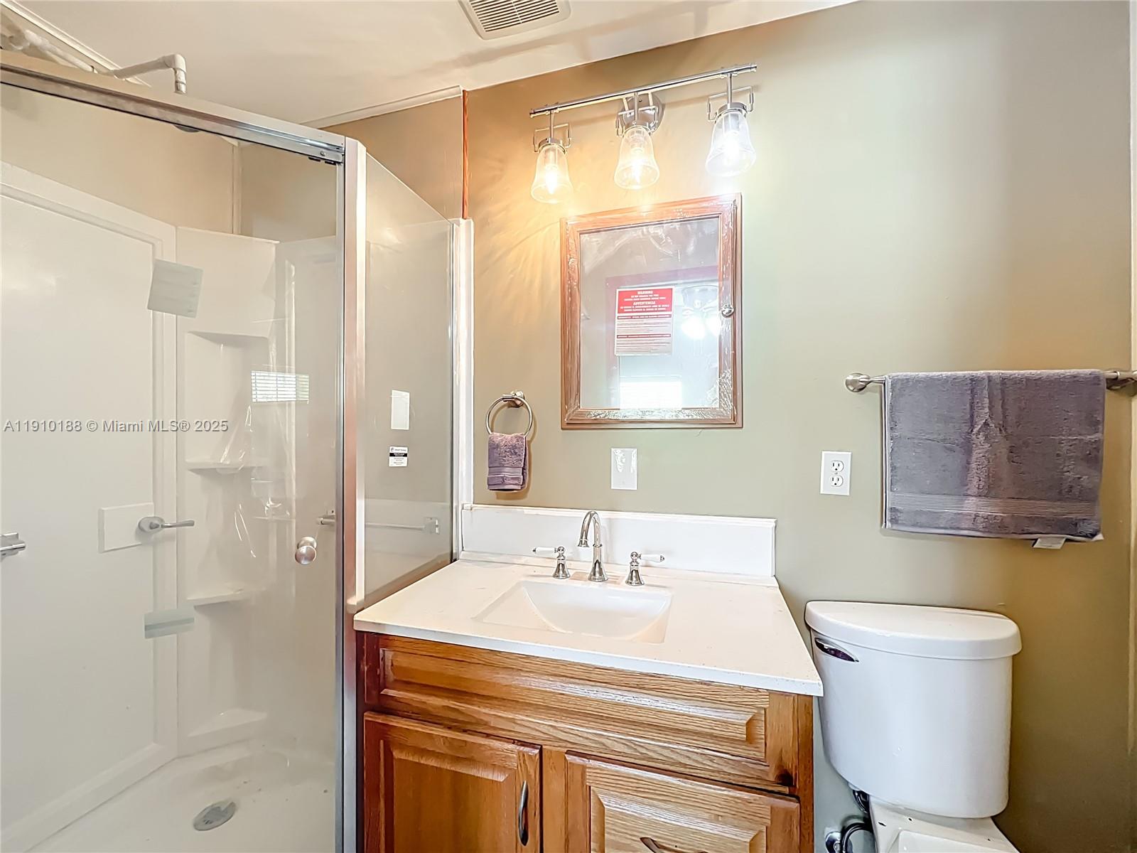 3144 Shell Lane LaBelle, FL 33935 - Photo 46 of 69 a bathroom with a sink a toilet and shower