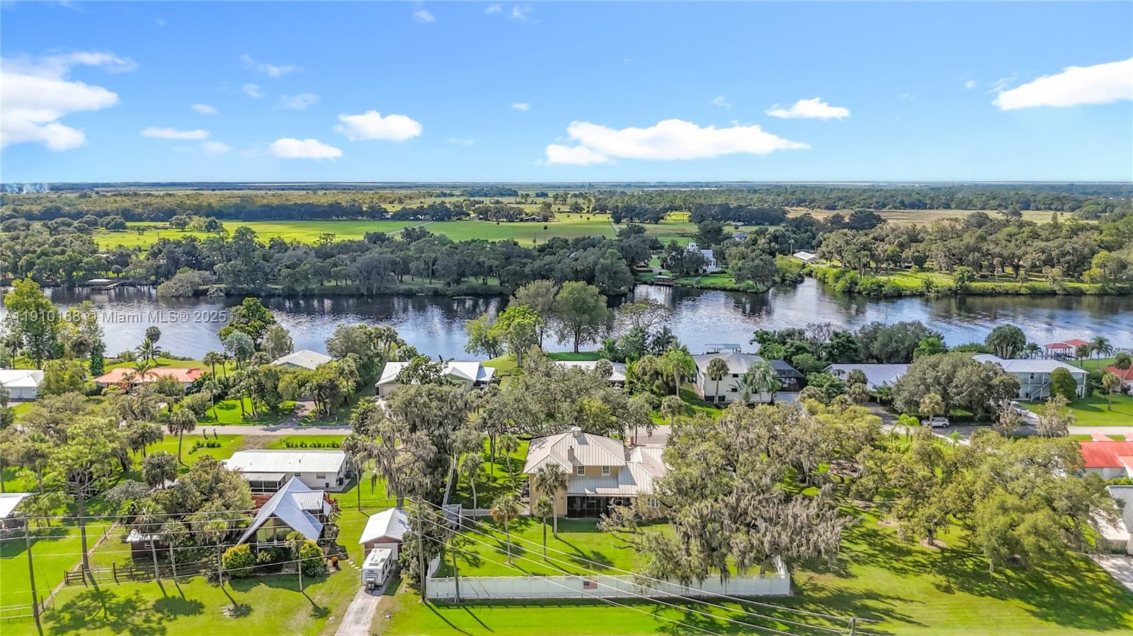 3144 Shell Lane LaBelle, FL 33935 - Photo 68 of 69 a view of a lake with a city