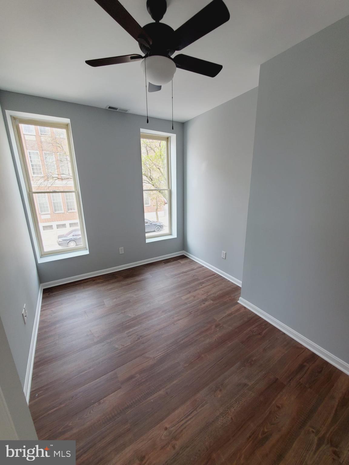 27 South Fulton Avenue Baltimore, MD 21223 - Photo 19 of 20 wooden floor in an empty room with a window