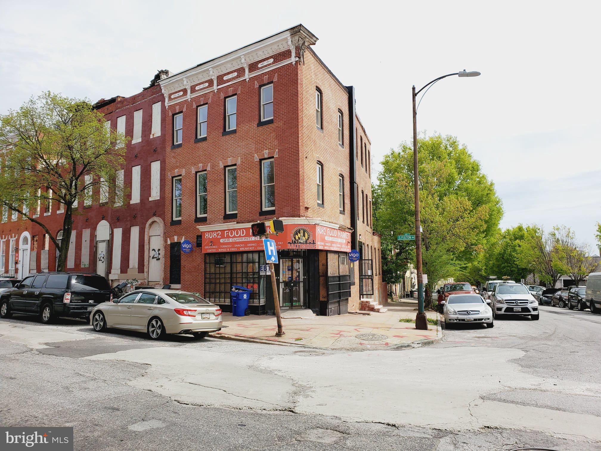 27 South Fulton Avenue Baltimore, MD 21223 - Photo 2 of 20 a car parked in front of a building