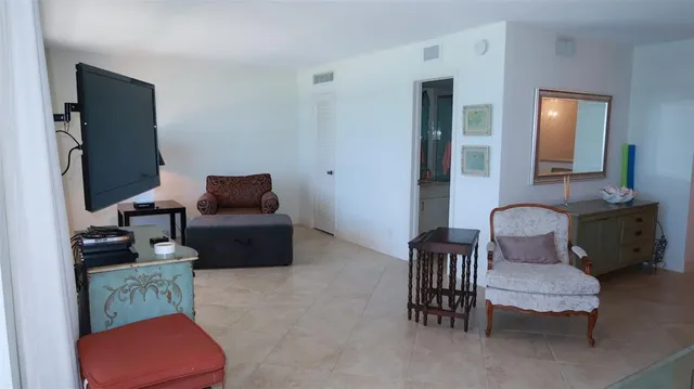 a living room with furniture and a chair