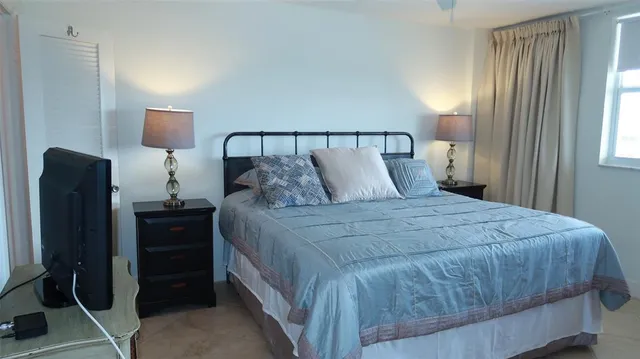 a bedroom with a bed and a closet