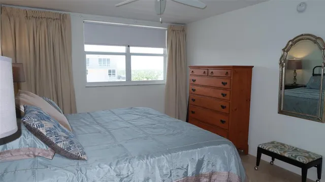 a bedroom with a bed and a dresser