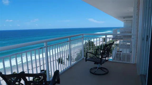 a view of swimming pool and seating area