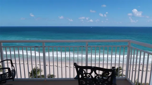 a view of a balcony with furniture