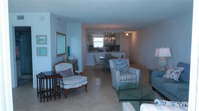 a living room with furniture and a lamp