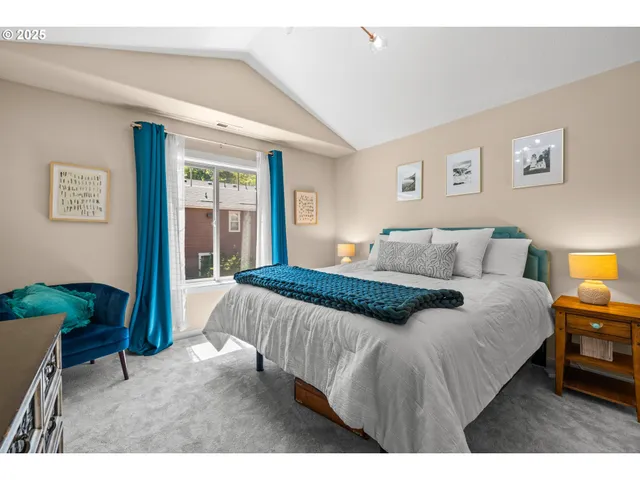 a bedroom with a bed and a tv