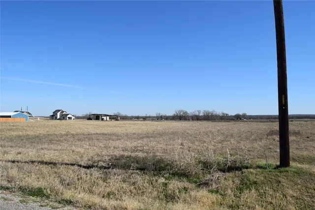a view of ocean with large building