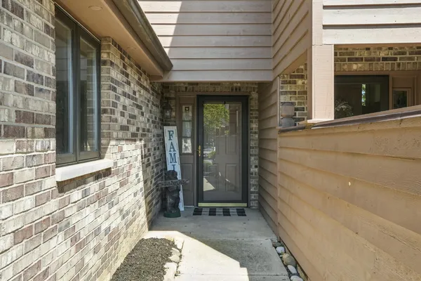 a front view of a house with a glass door