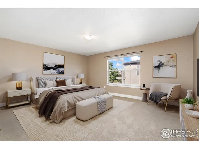 a bedroom with a bed and glass window