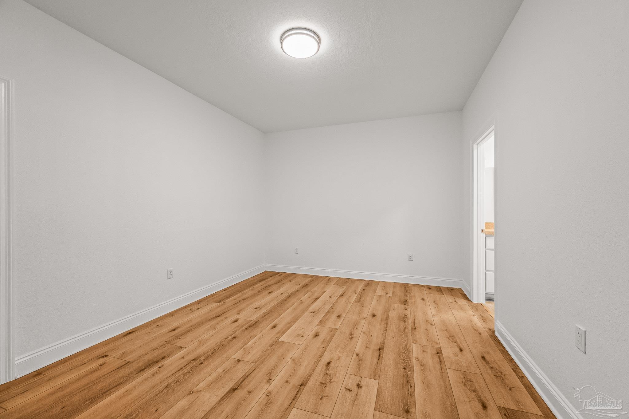 7693 Petersen Point Road Milton, FL 32583 - Photo 20 of 58 wooden floor in a room