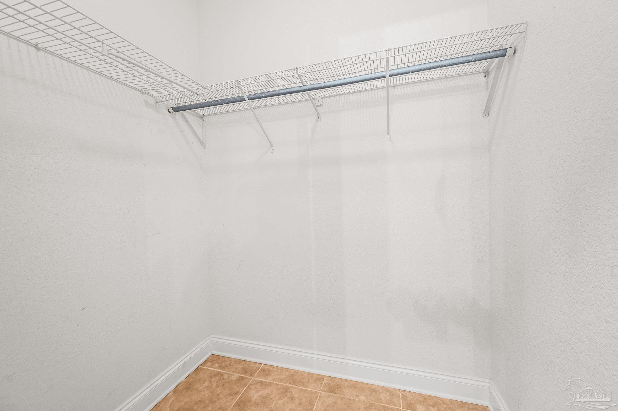 7693 Petersen Point Road Milton, FL 32583 - Photo 25 of 58 a view of a room with racks on the wall