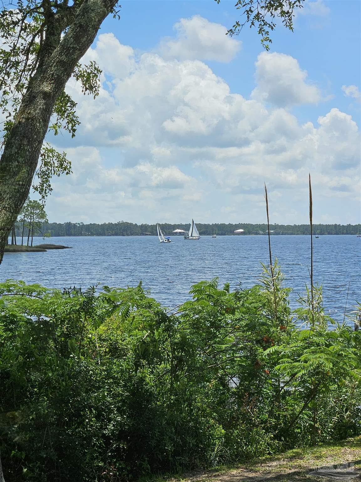 7693 Petersen Point Road Milton, FL 32583 - Photo 27 of 58 a view of a yard with an ocean