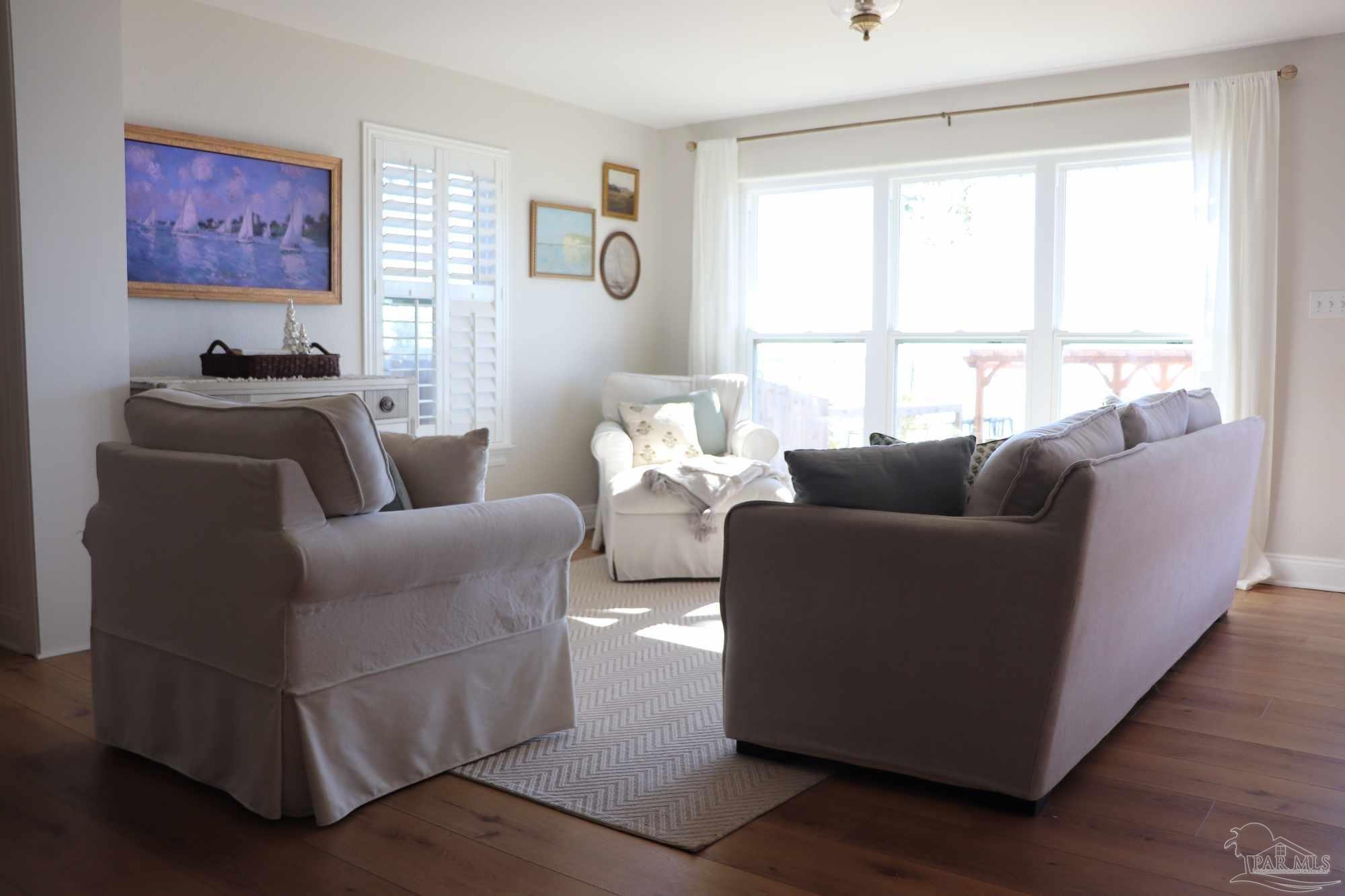 7693 Petersen Point Road Milton, FL 32583 - Photo 39 of 58 a living room with furniture and a window