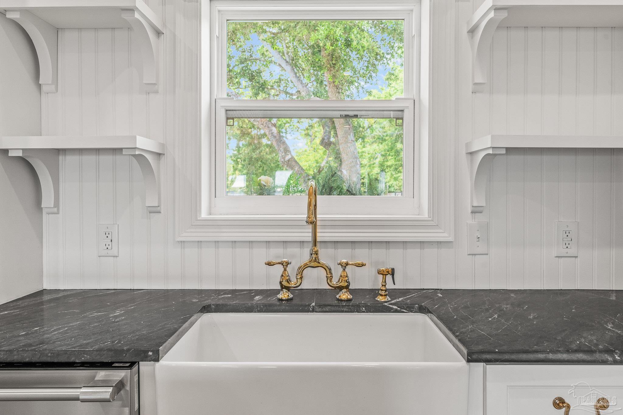 7693 Petersen Point Road Milton, FL 32583 - Photo 5 of 58 a bathroom with a granite countertop sink and window