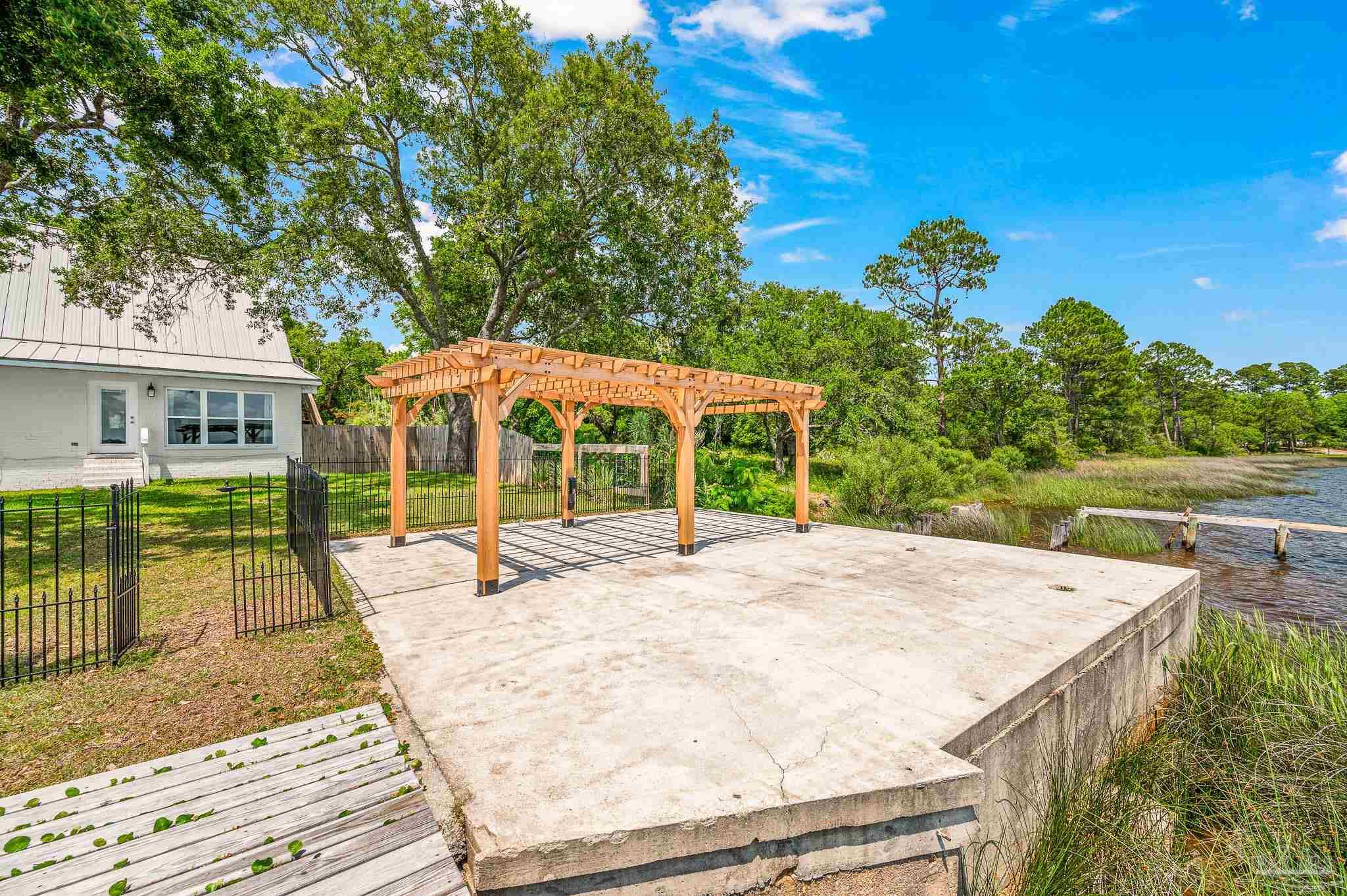 7693 Petersen Point Road Milton, FL 32583 - Photo 52 of 58 front view of a house with a porch