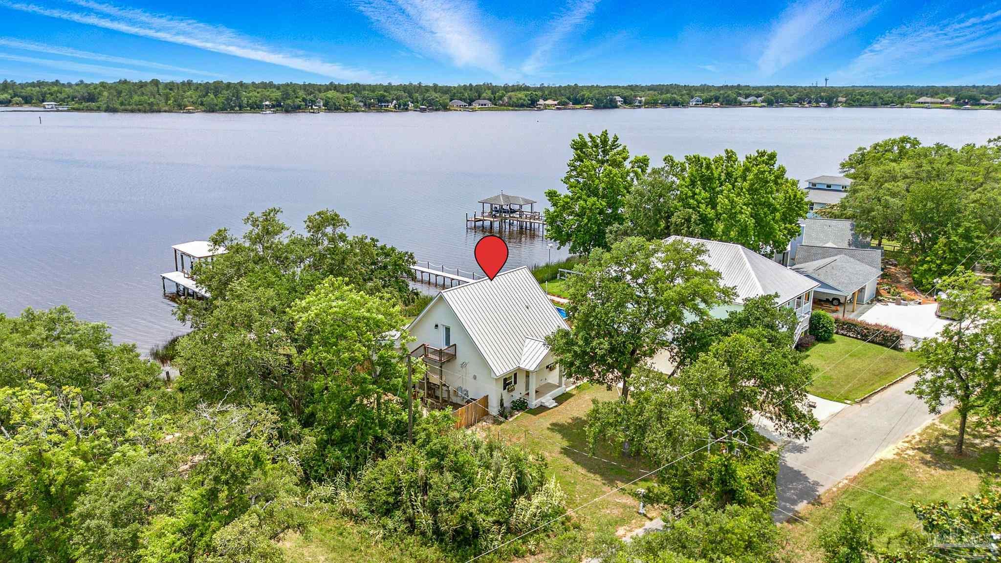 7693 Petersen Point Road Milton, FL 32583 - Photo 57 of 58 a view of a lake and a mountain view