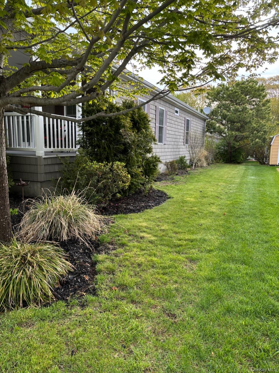 1661 Old Country Road, Unit 539 Riverhead, NY 11901 - Photo 4 of 26 a house view with a garden space