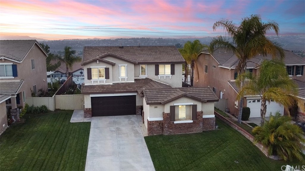 33902 Abbey Road Temecula, CA 92592 - Photo 1 of 1 a front view of a house with a garden and trees