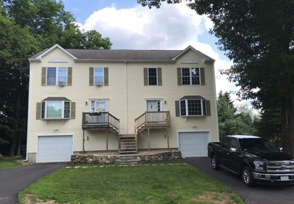 10 Central Tree Road, Unit 10 Rutland, MA 01543 - Photo 1 of 25 a view of a yard in front of house