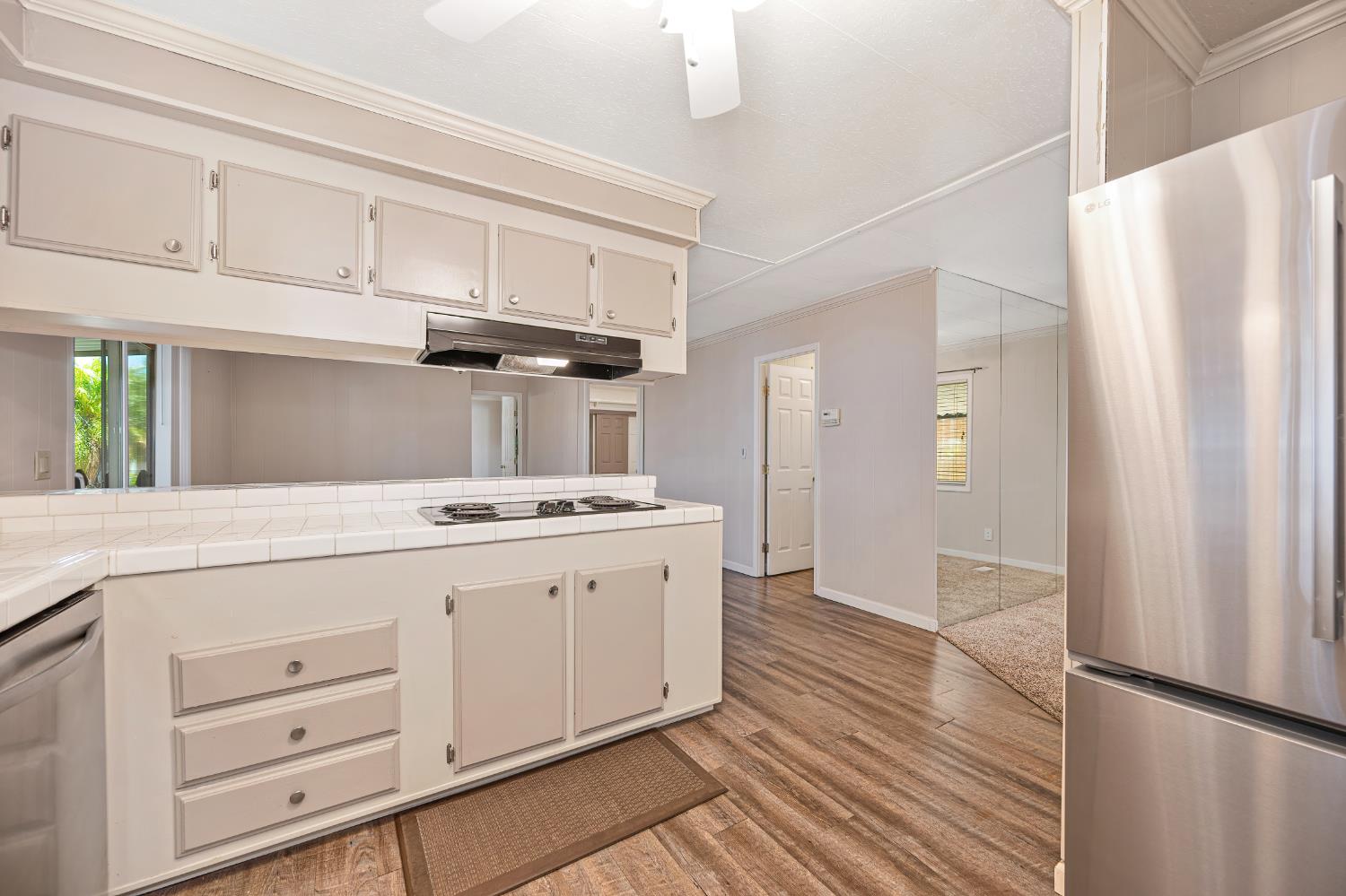 4237 Pinewood Street Rocklin, CA 95677 - Photo 18 of 54 a kitchen with granite countertop white cabinets and white appliances
