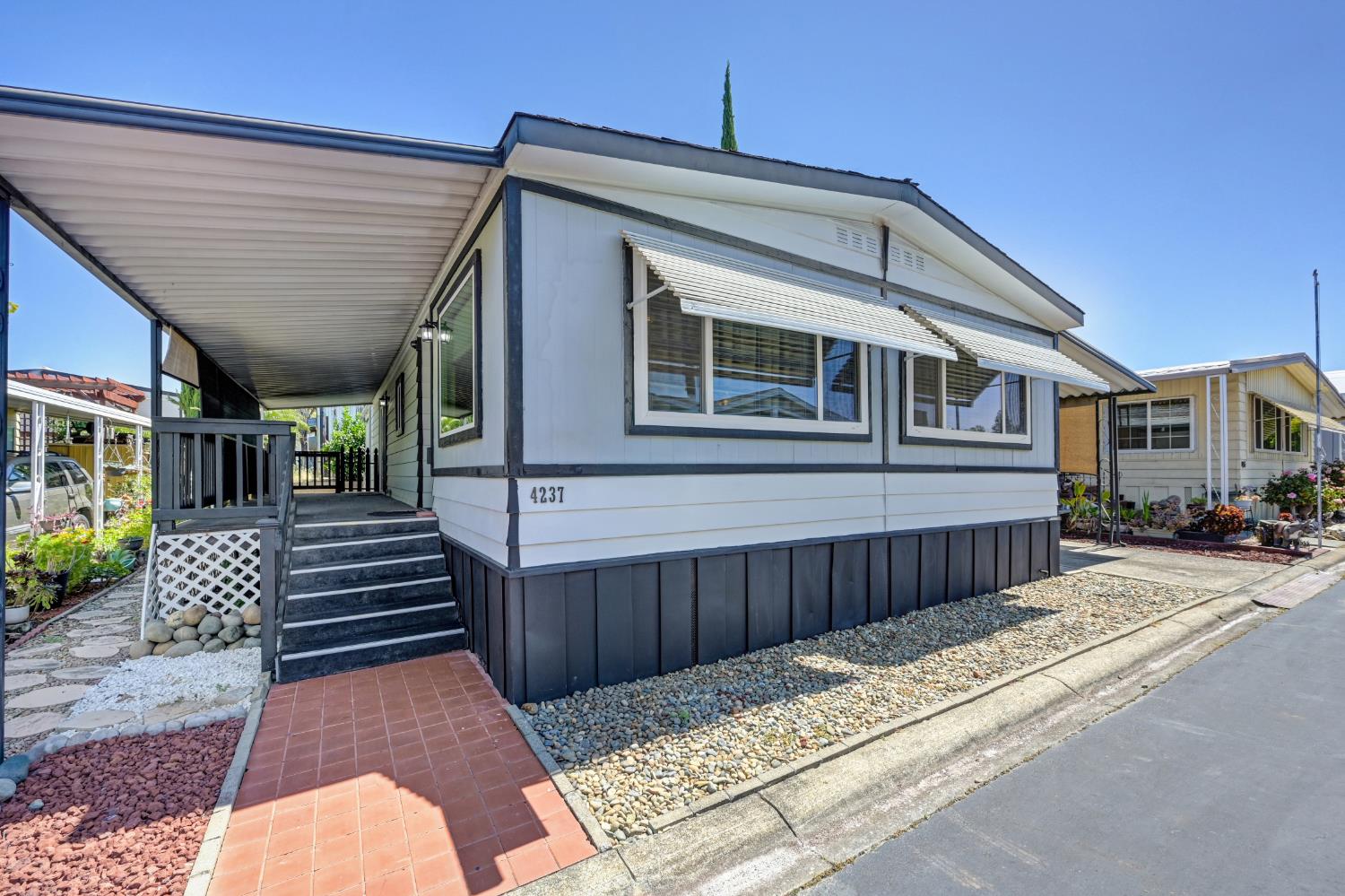 4237 Pinewood Street Rocklin, CA 95677 - Photo 2 of 54 a front view of a house with a garden