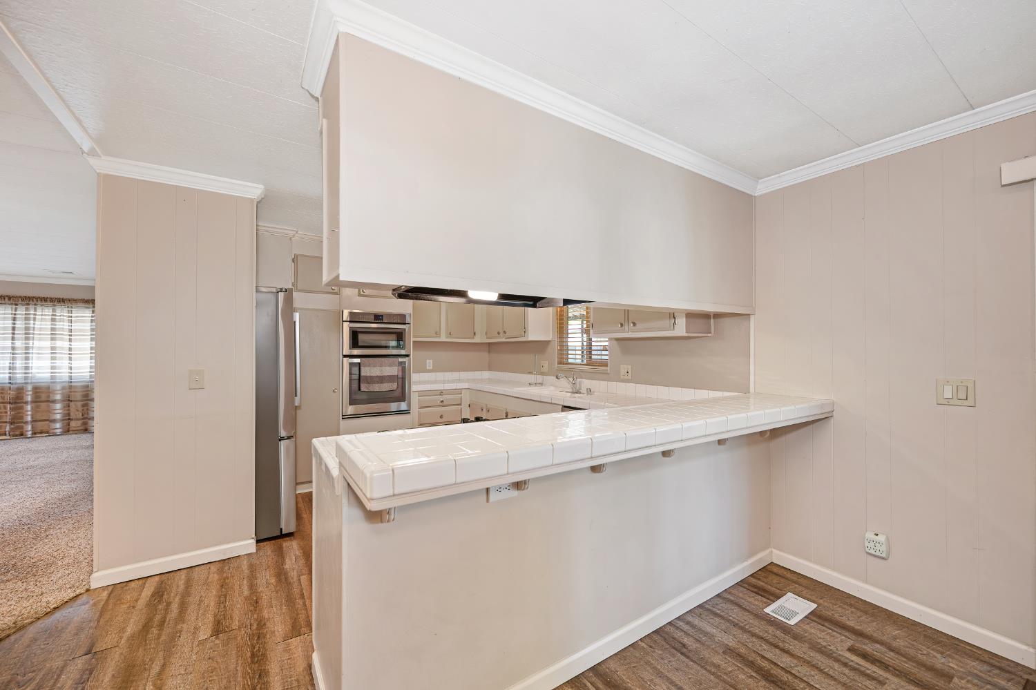 4237 Pinewood Street Rocklin, CA 95677 - Photo 21 of 54 a kitchen with a sink and a refrigerator