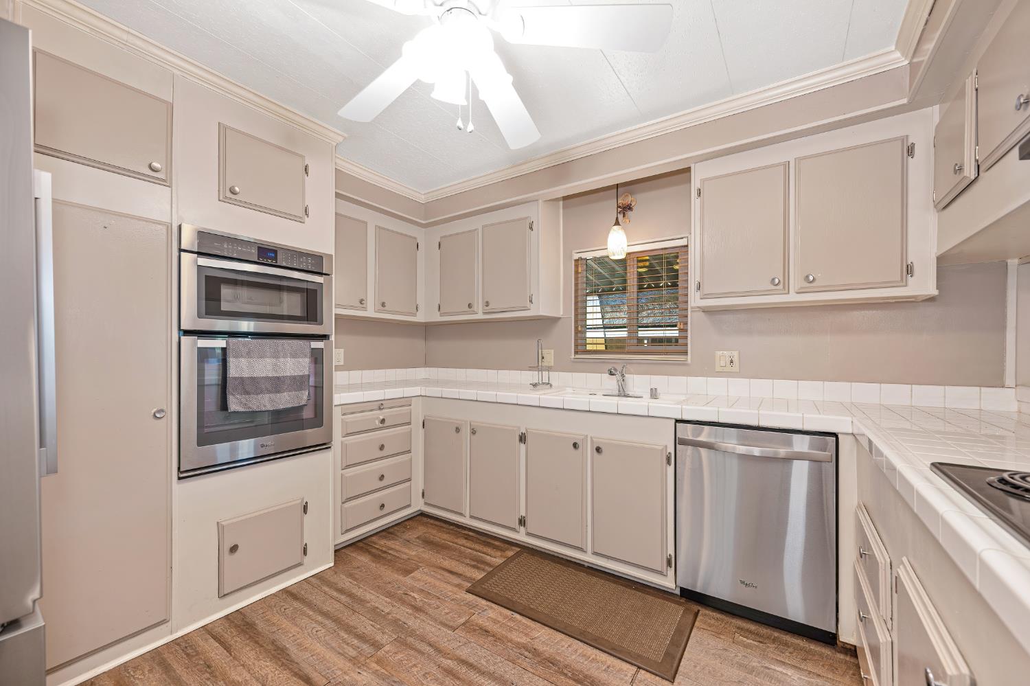 4237 Pinewood Street Rocklin, CA 95677 - Photo 24 of 54 a kitchen with granite countertop cabinets stainless steel appliances and a counter space