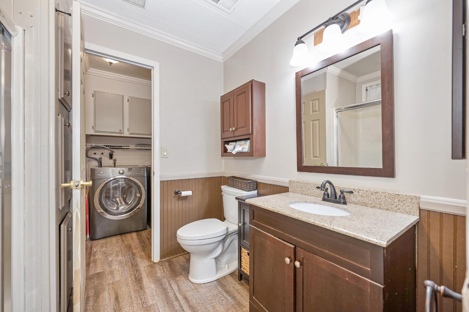 4237 Pinewood Street Rocklin, CA 95677 - Photo 28 of 54 a bathroom with a toilet a sink and mirror