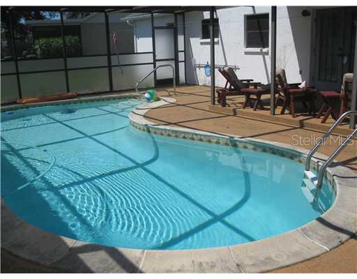 7202 Orchid Lake Road New Port Richey, FL 34653 - Photo 1 of 1 a view of a indoor swimming pool