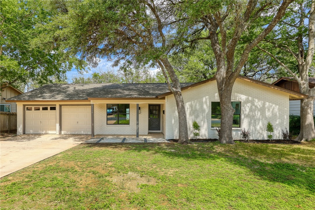 2110 Whitestone Drive Austin, TX 78745 - Photo 1 of 1 a house with trees in the background