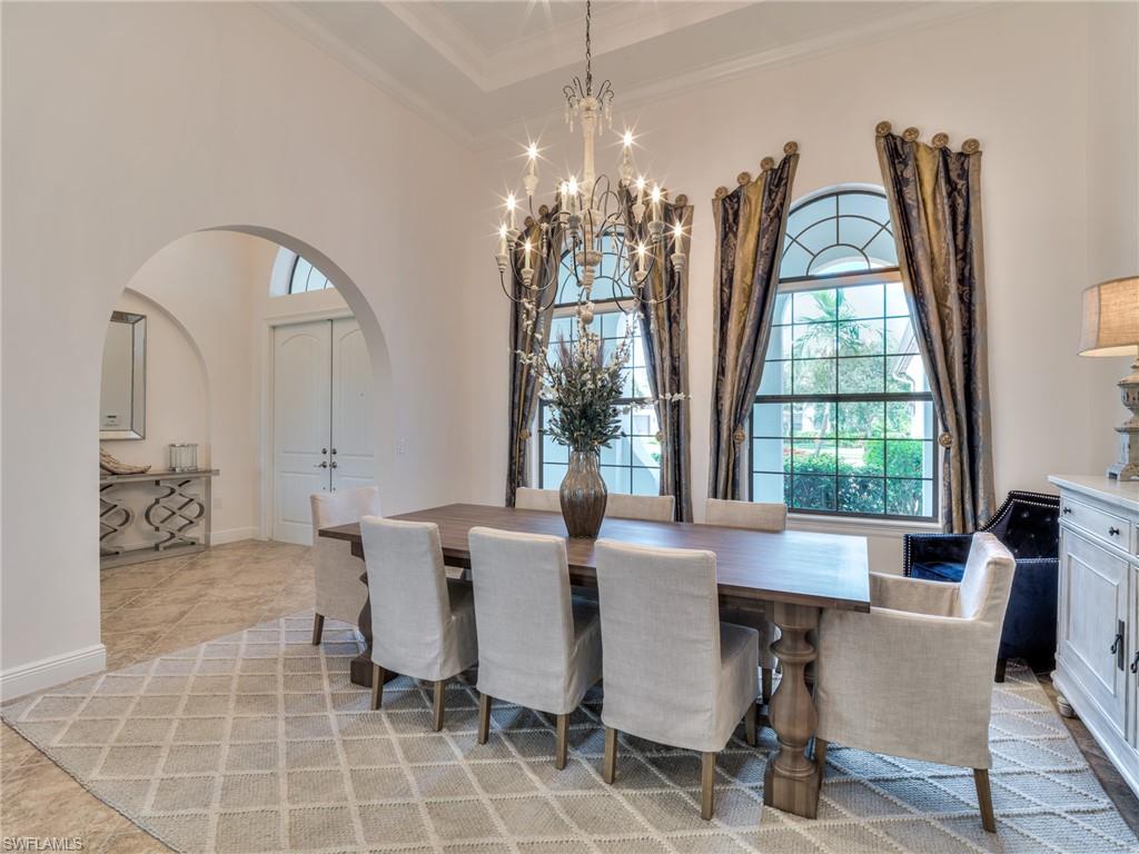 14468 Marsala Way Naples, FL 34109 - Photo 11 of 41 a view of a dining room with furniture and chandelier
