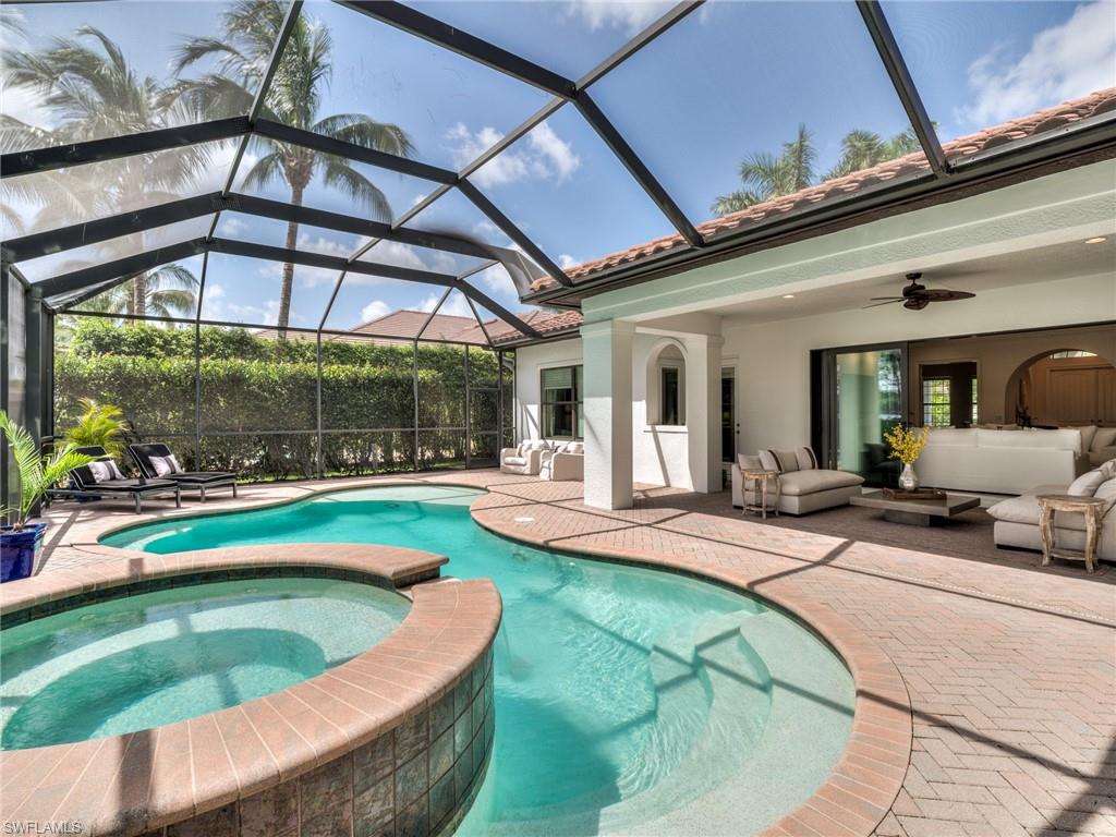 14468 Marsala Way Naples, FL 34109 - Photo 20 of 41 a view of swimming pool with outdoor seating