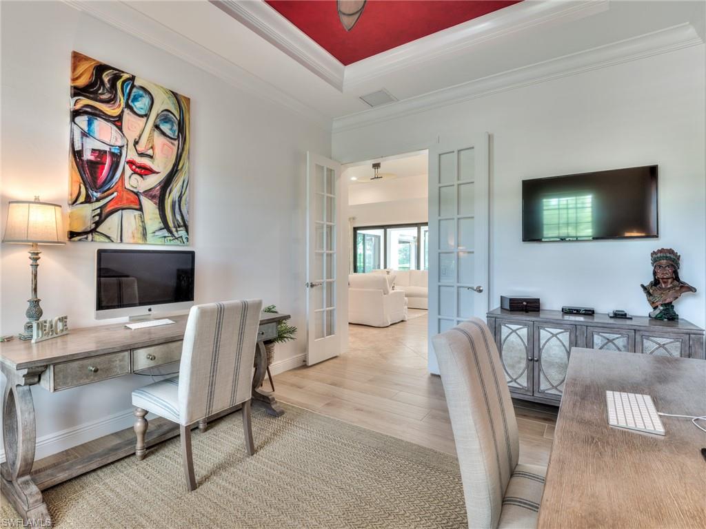 14468 Marsala Way Naples, FL 34109 - Photo 26 of 41 a view of a livingroom with furniture and a flat screen tv
