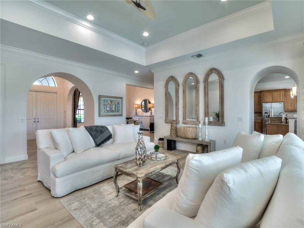 14468 Marsala Way Naples, FL 34109 - Photo 5 of 41 a living room with furniture and a large mirror