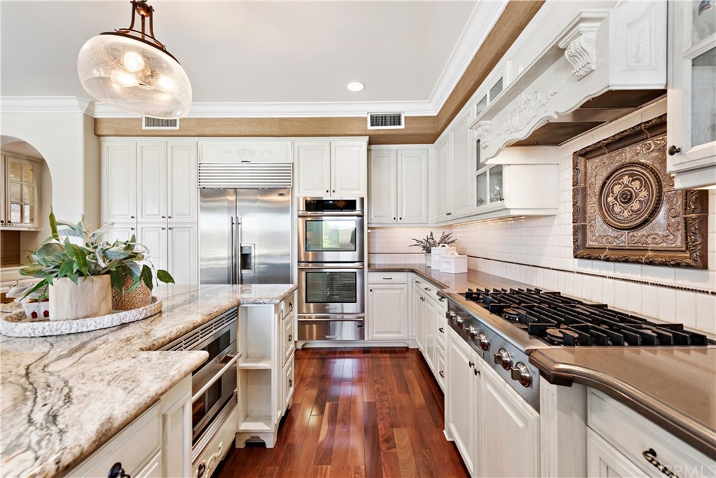 37 Oak View Drive Aliso Viejo, CA 92656 - Photo 13 of 46 a kitchen with a stove and a wooden floors