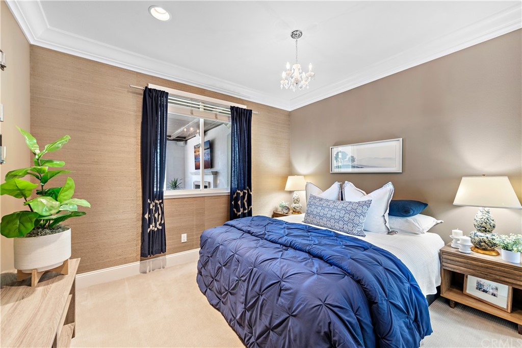 37 Oak View Drive Aliso Viejo, CA 92656 - Photo 18 of 46 a bedroom with a bed and a chandelier