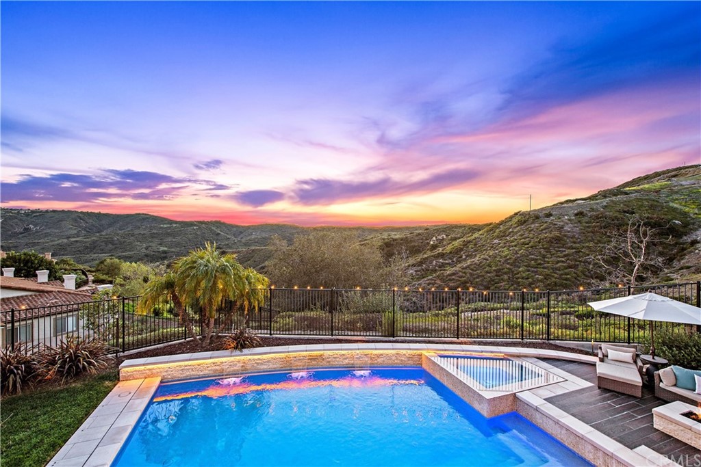 37 Oak View Drive Aliso Viejo, CA 92656 - Photo 2 of 46 a view of swimming pool with a table and chairs under an umbrella